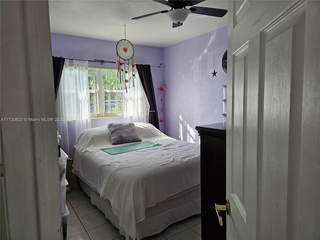 bedroom featuring ceiling fan and light tile patterned floors