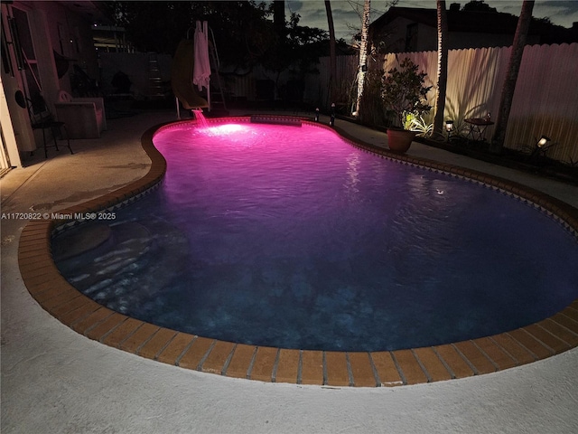 view of pool with a water slide