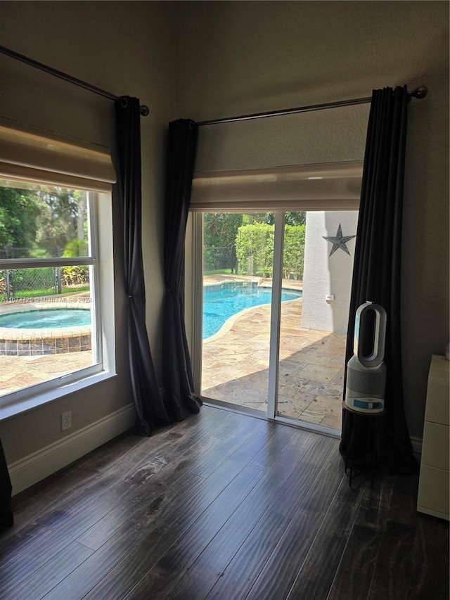 doorway with dark hardwood / wood-style floors