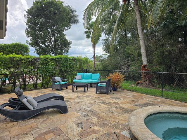 view of patio featuring an outdoor hangout area and a jacuzzi