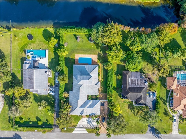 birds eye view of property featuring a water view