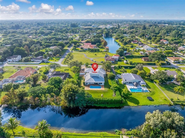 birds eye view of property featuring a water view