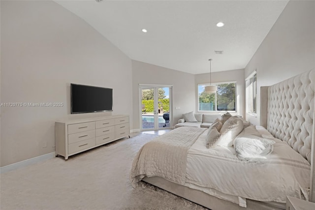 bedroom with access to exterior, light colored carpet, multiple windows, and vaulted ceiling