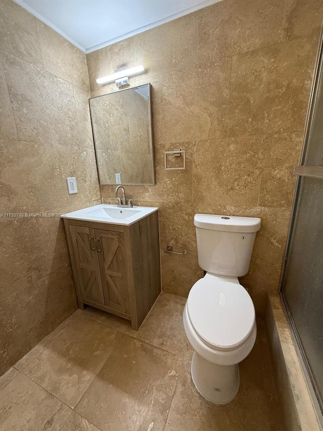 bathroom featuring vanity, toilet, and ornamental molding