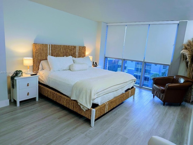 bedroom featuring light wood-style flooring