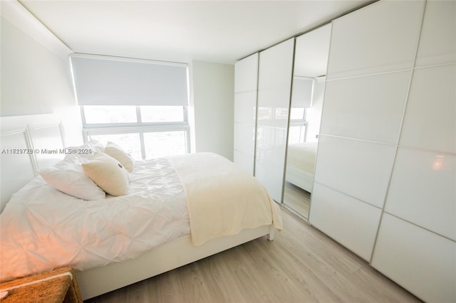 bedroom with light wood-style flooring