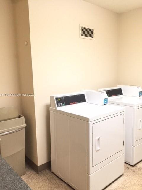 laundry room with washing machine and dryer