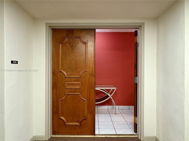 hallway featuring light tile patterned floors