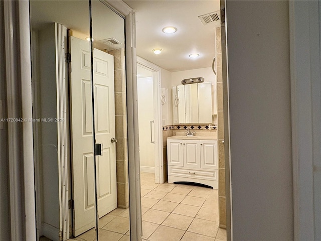 bathroom featuring tile patterned floors and vanity