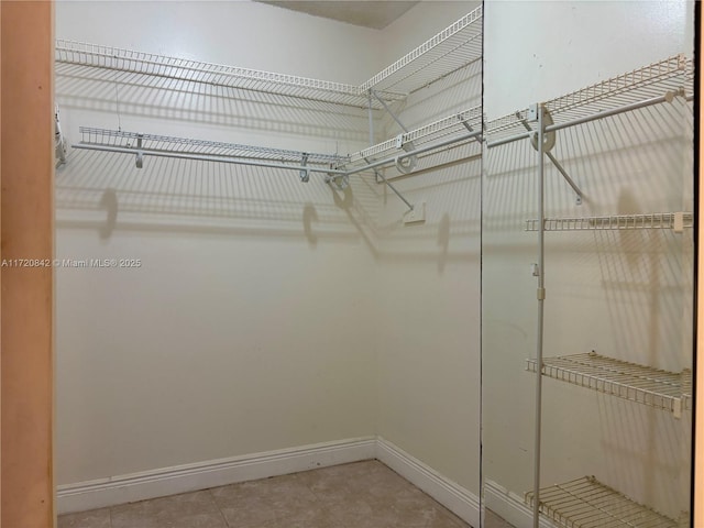 5900 SW 127th Ave Unit 3218, Miami, FL 33183 - walk in closet featuring light tile patterned floors