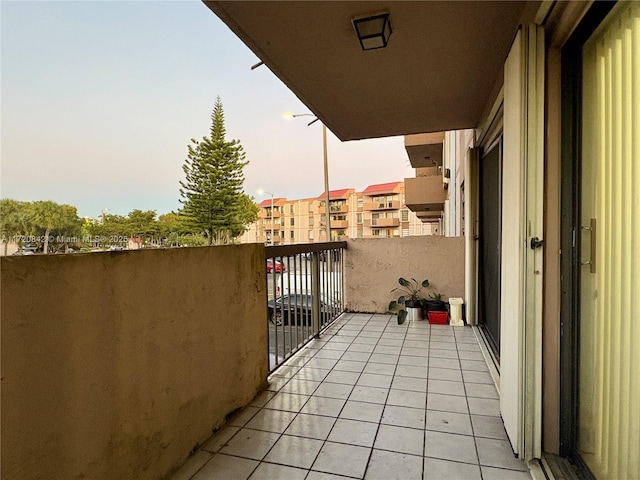 view of balcony at dusk