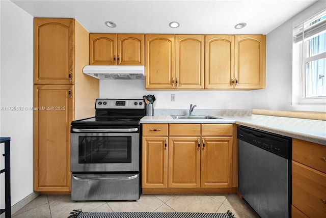 kitchen featuring light tile patterned flooring, stainless steel appliances, and sink