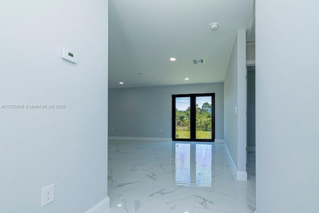 spare room featuring french doors