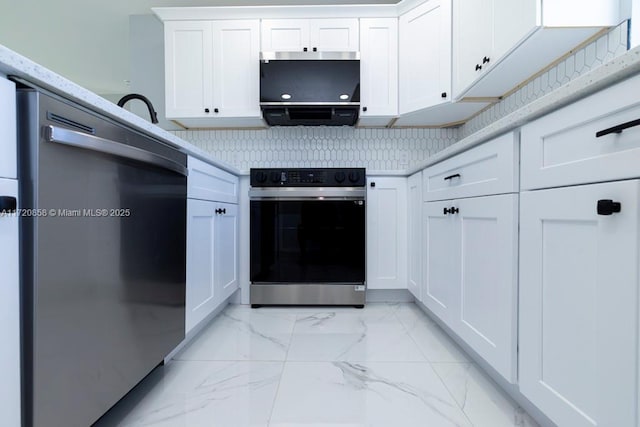 kitchen with white cabinets, decorative backsplash, and stainless steel appliances