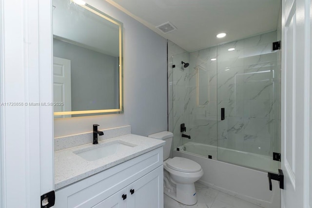 full bathroom with vanity, toilet, and shower / bath combination with glass door