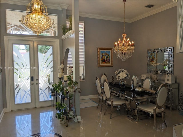 dining space with a chandelier, ornamental molding, light tile patterned floors, and french doors