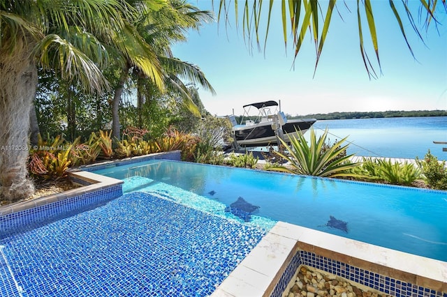 view of pool with a water view