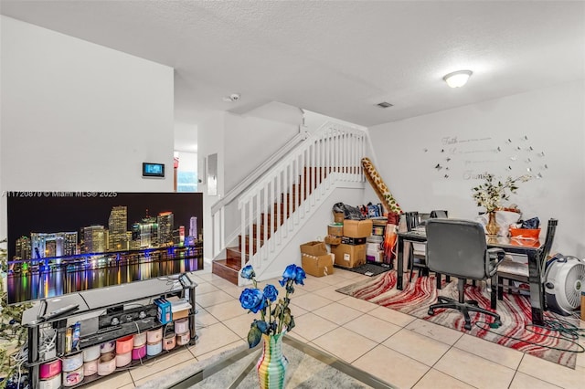 interior space featuring tile patterned flooring and a textured ceiling