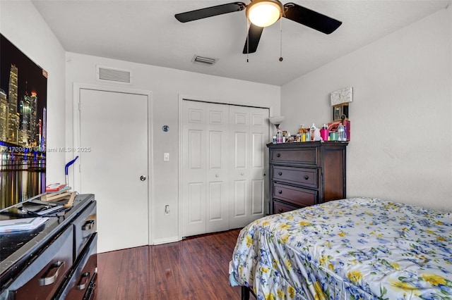 bedroom with ceiling fan and dark wood-type flooring