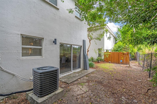 view of yard with central AC unit