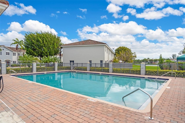 view of swimming pool with a patio