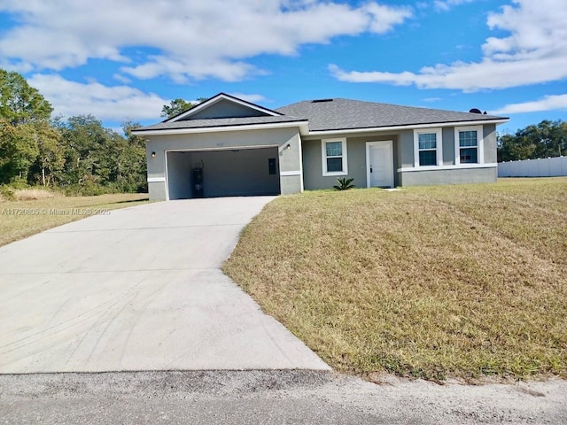 single story home with a garage and a front lawn