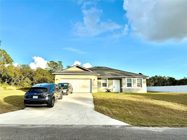 ranch-style home featuring a front lawn and a garage