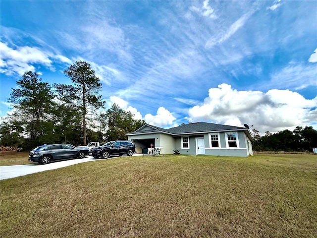 view of front of house featuring a garage and a front yard