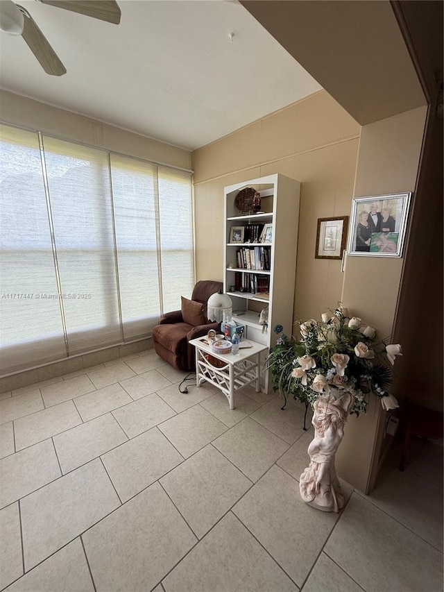 unfurnished room featuring ceiling fan, a healthy amount of sunlight, and light tile patterned floors