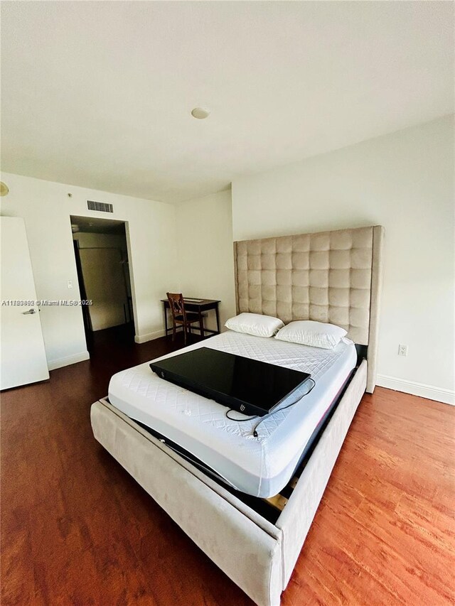 bedroom featuring wood-type flooring