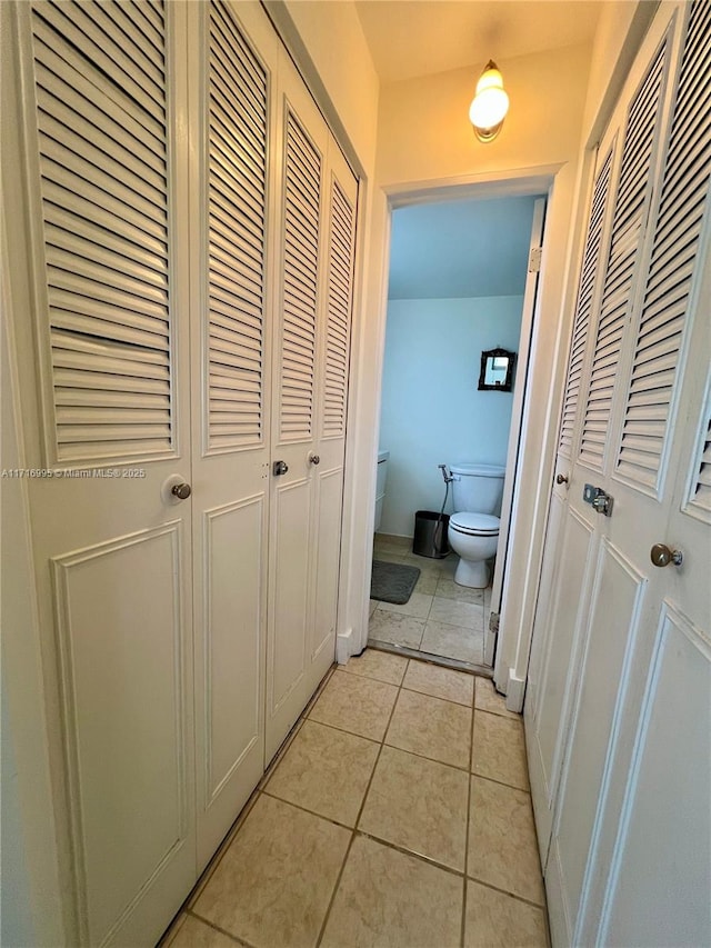 corridor featuring light tile patterned flooring