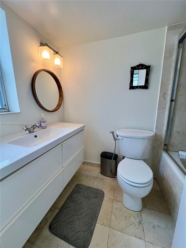 full bathroom featuring toilet, shower / washtub combination, and vanity