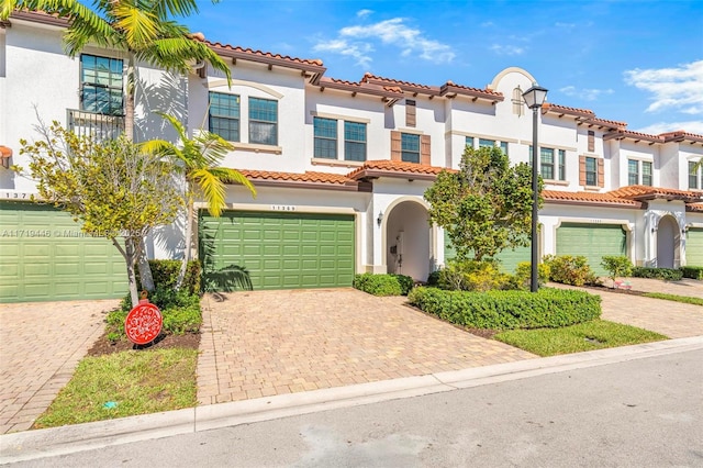 mediterranean / spanish-style house with a garage