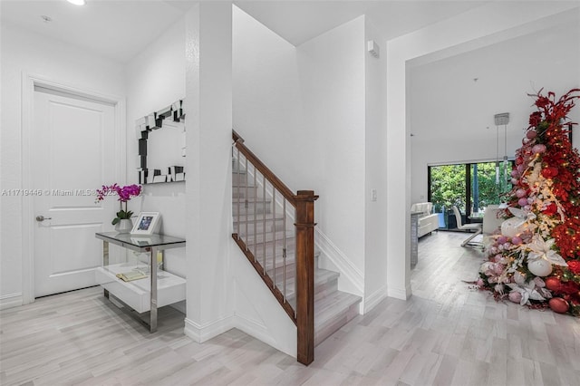 stairs with wood-type flooring