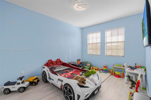 bedroom with light hardwood / wood-style floors