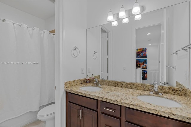 full bathroom featuring vanity, shower / bath combination with curtain, and toilet