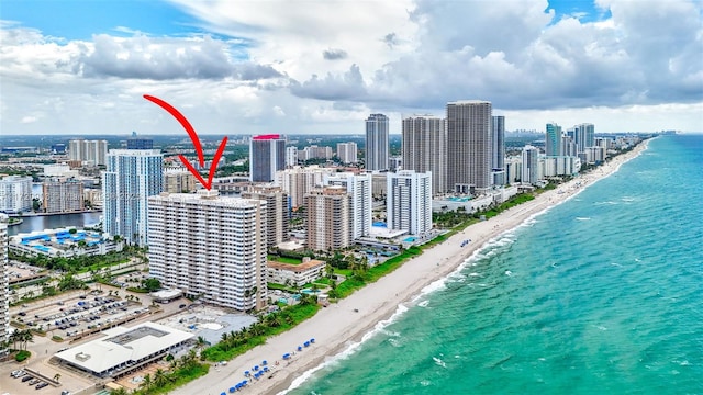 aerial view featuring a view of the beach and a water view