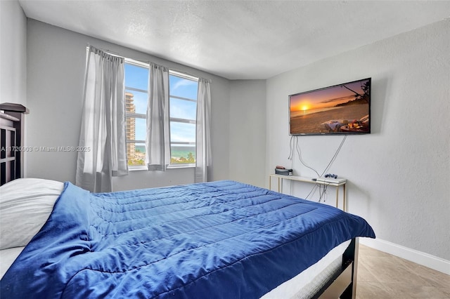 bedroom featuring tile patterned floors