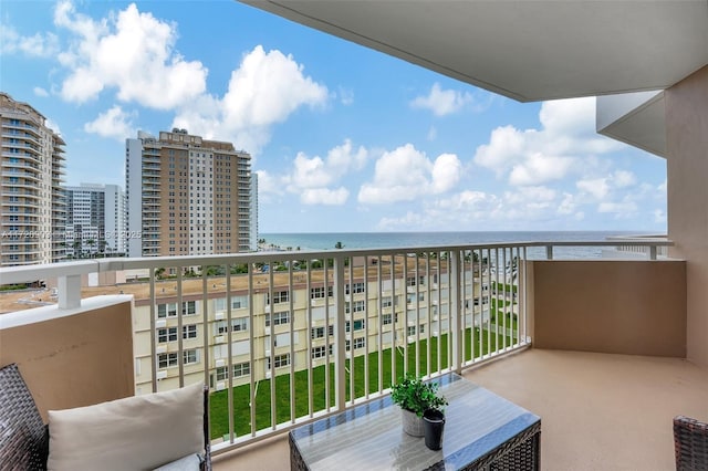 balcony featuring a water view