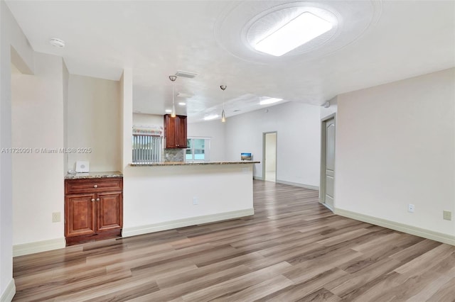 unfurnished living room with light wood-type flooring