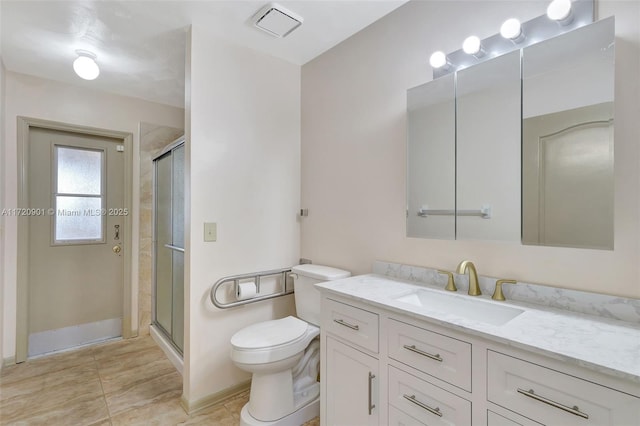 bathroom with an enclosed shower, vanity, and toilet