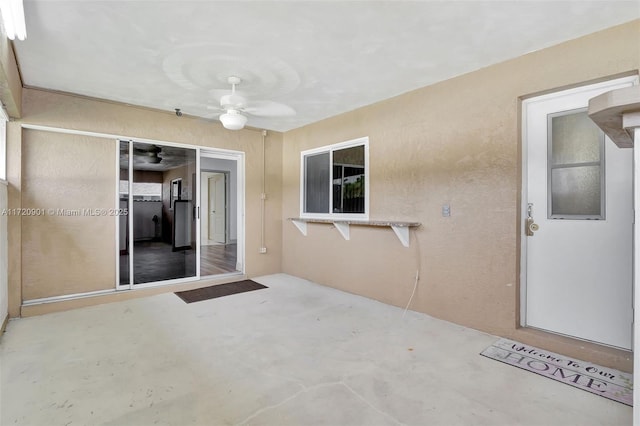 view of patio / terrace featuring ceiling fan