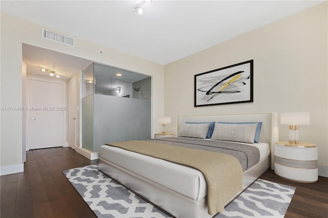 bedroom with dark wood-type flooring