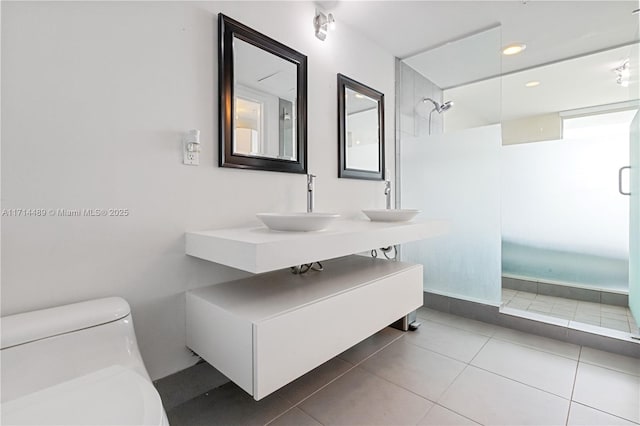 bathroom with tile patterned floors, vanity, and toilet