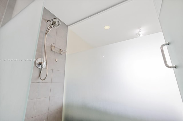 bathroom featuring a shower with door