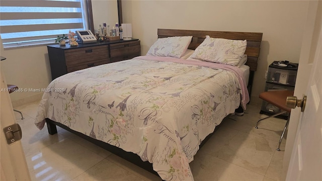 bedroom featuring light tile patterned floors