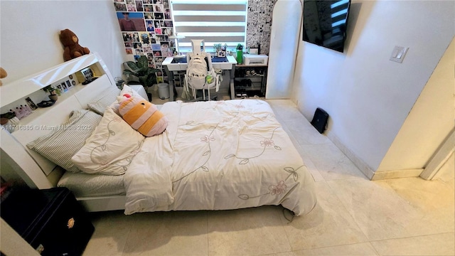 bedroom with light tile patterned flooring