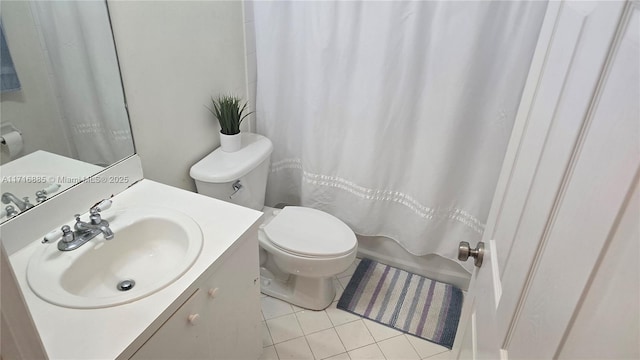 bathroom with shower / bath combo with shower curtain, vanity, toilet, and tile patterned floors