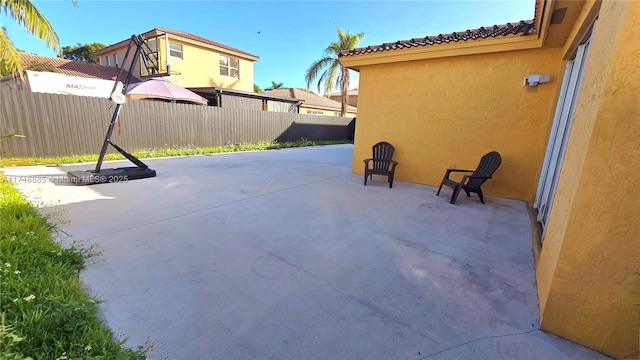 view of patio / terrace featuring fence