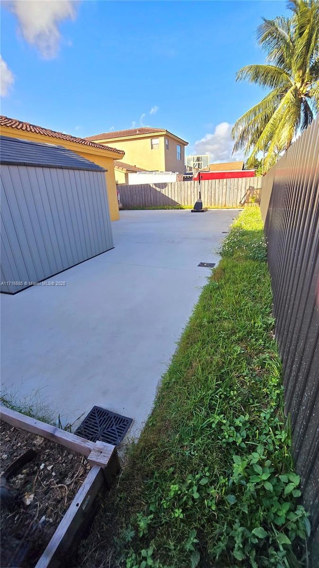 view of yard with a fenced backyard and a patio